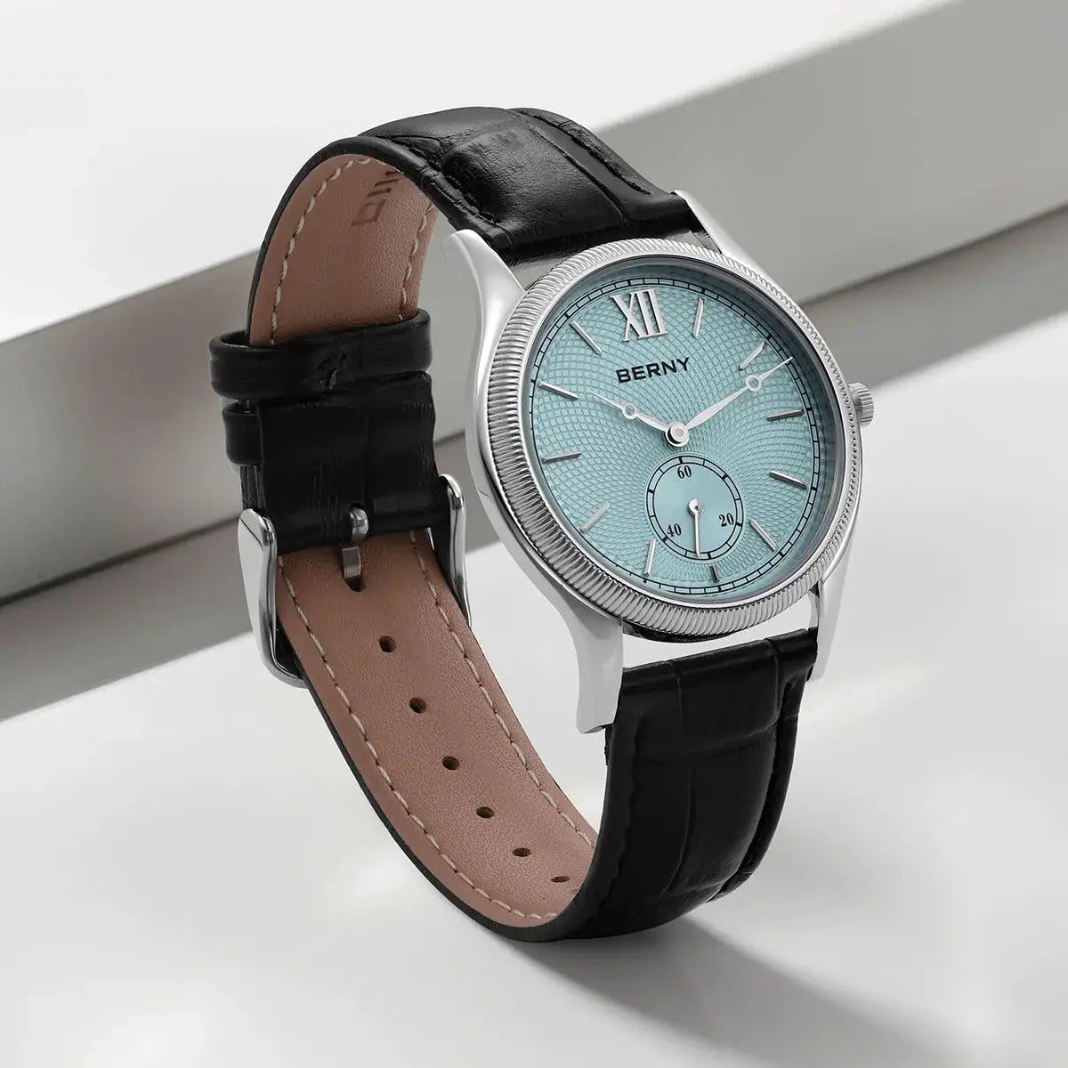 BERNY men's dress watch with a light blue textured dial and black leather strap.