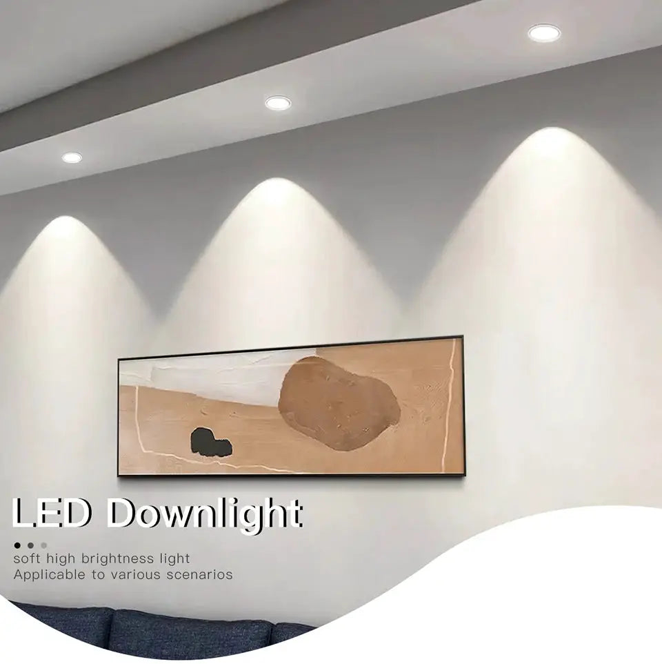 Four aluminum LED recessed downlights installed in ceiling