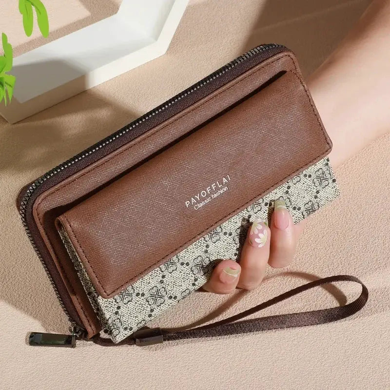 Men's faux leather wallet, color-block brown with patterned fabric, zip pocket and photo slot, wrist strap.