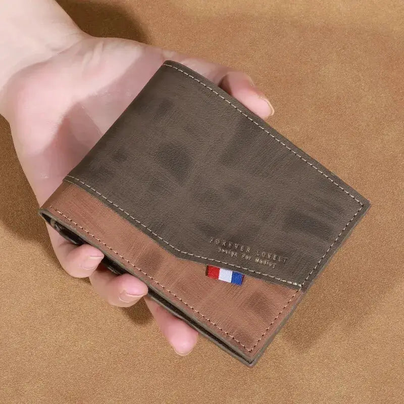 Men's high-capacity leather wallet, two-tone brown and gray with white stitching and a small French flag accent.