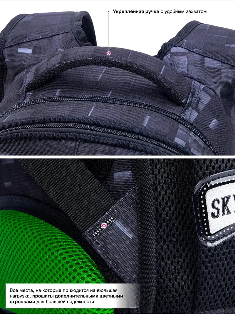 School backpack for kids in dark gray with padded handle, multiple zippered compartments and green mesh side pocket