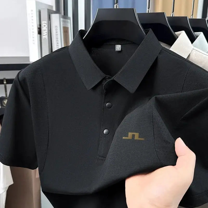 Men's black short-sleeve polo shirt by Simples Market with a two-button placket and small gold left-chest logo.