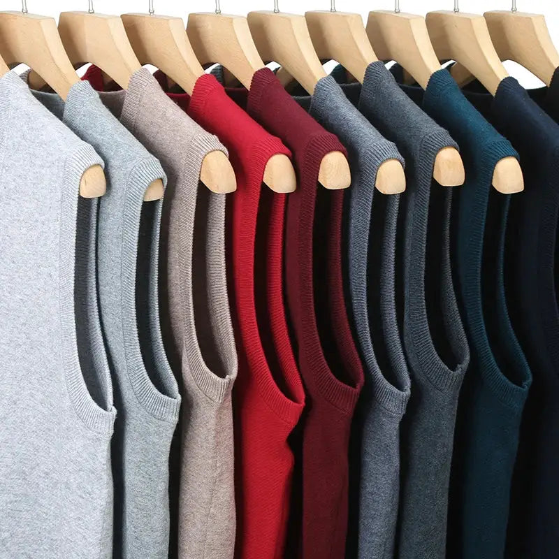 Men's casual knitted sweater vest by Simples Market in assorted colors on hangers