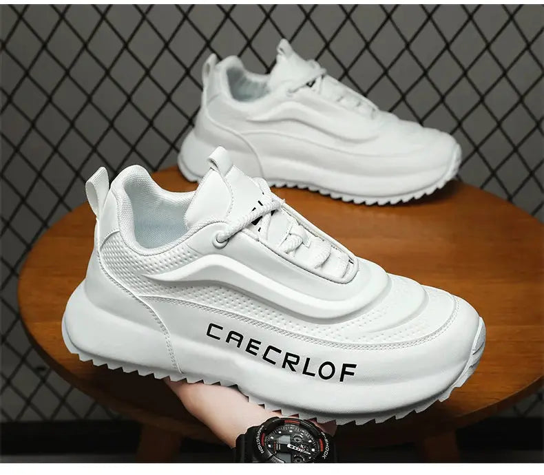 CAERCLOF white lightweight non-slip sneakers by Simples Market, two shoes on display.