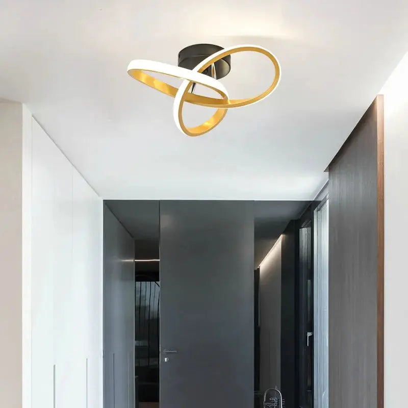 Modern LED ceiling light by Simples Market with interlocking gold and white rings, surface-mounted hallway fixture.