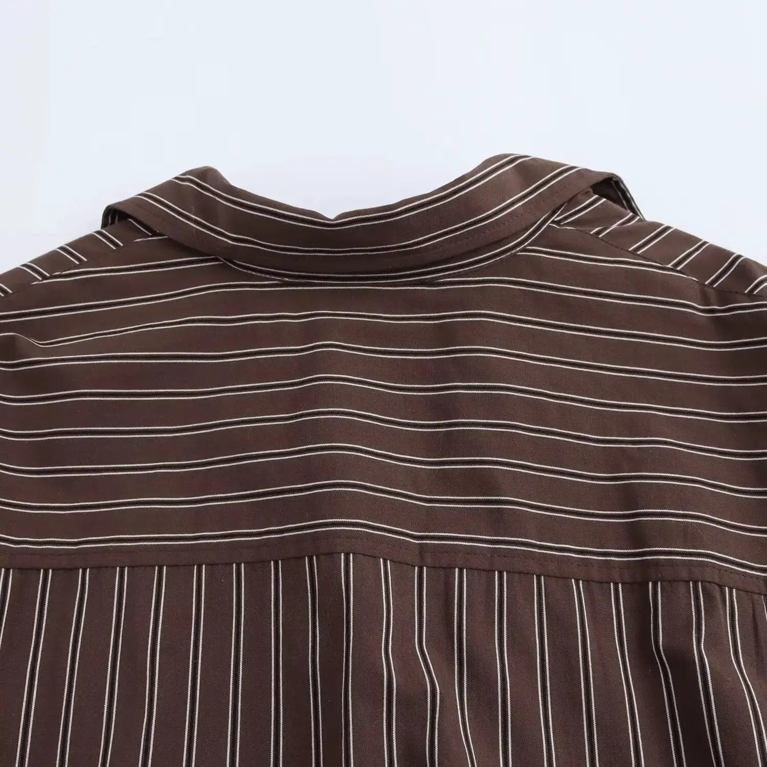 Brown striped women's blouse with turn-down collar, long sleeves and buttoned front