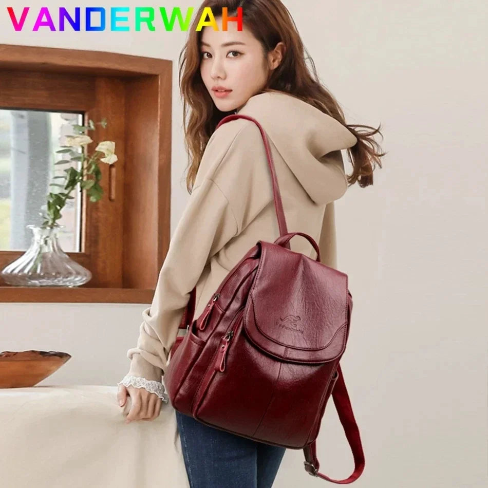 Genuine women's soft burgundy leather backpack with flap and front pockets