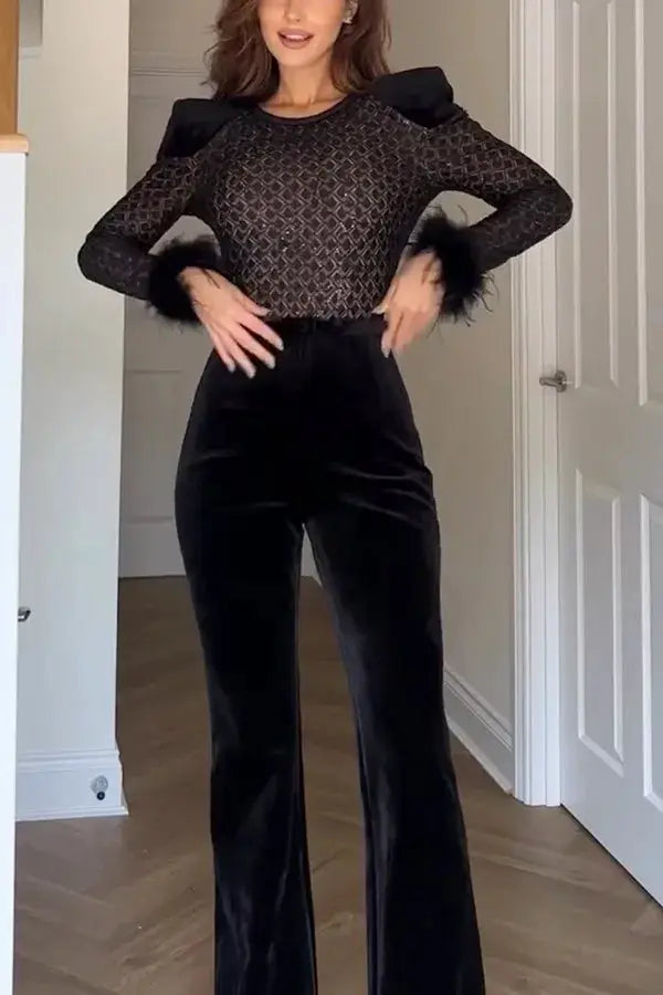 Black velvet jumpsuit with sheer mesh long sleeves and fluffy cuffs, wide-leg pants