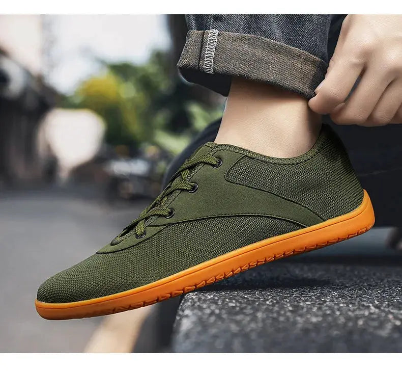 Simples Market men's minimalist barefoot trail running shoe in olive green with orange sole