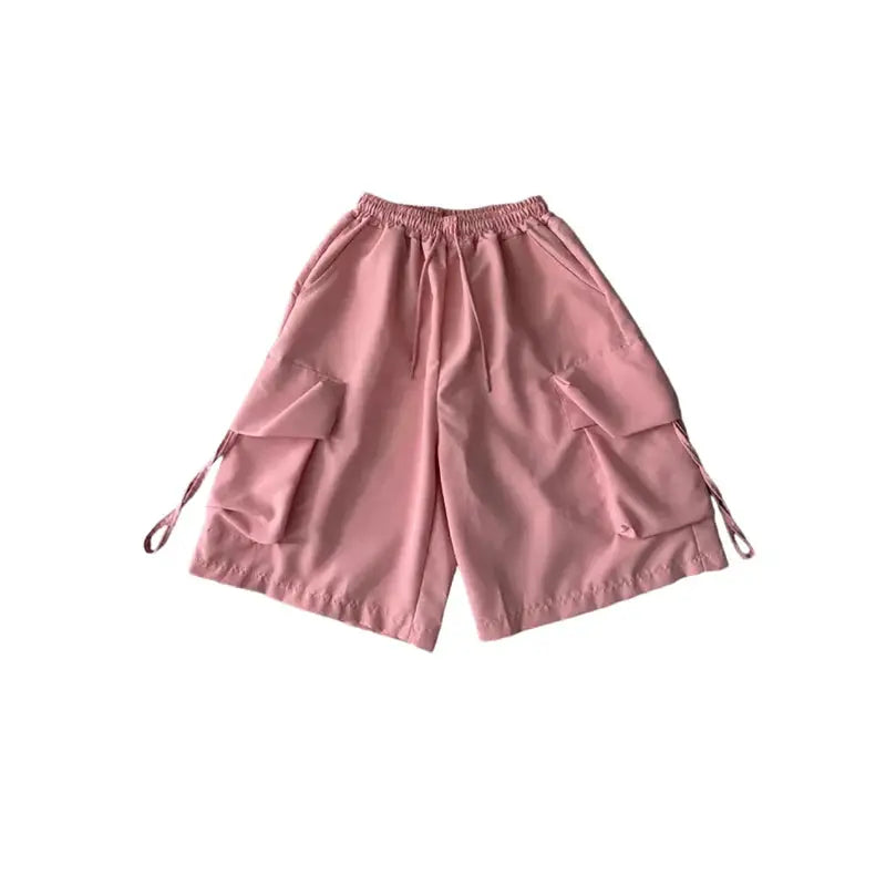 ZOKI women pink high-waist cargo shorts with large side pockets, drawstring waist, loose wide-leg fit.
