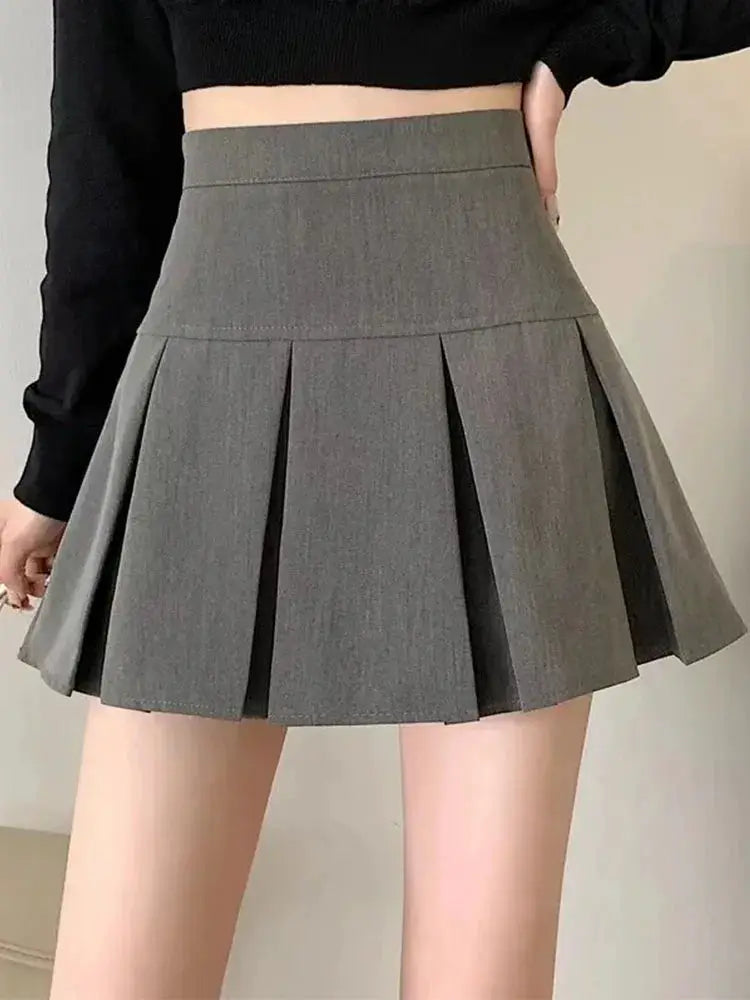 Women's gray high-waist pleated mini skirt with wide waistband; vintage school-uniform style