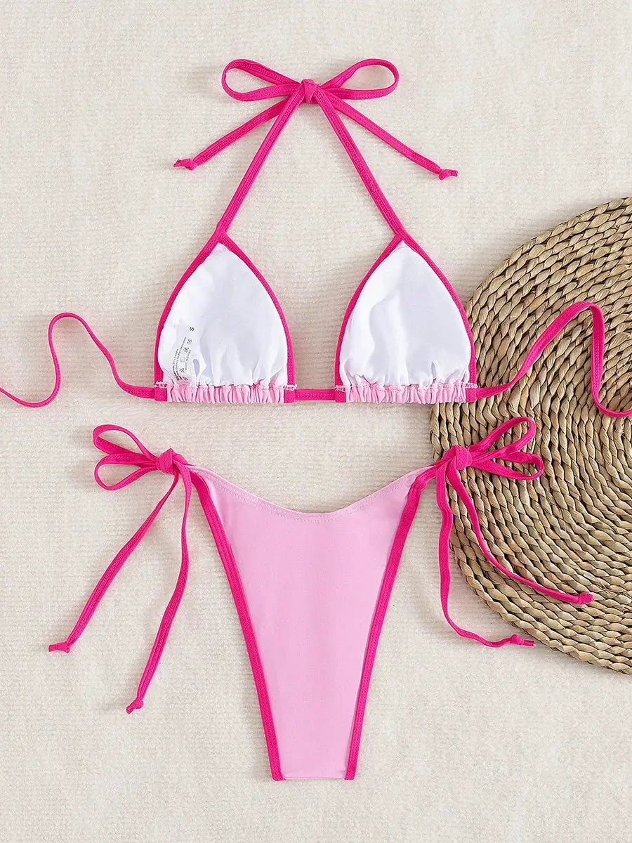 Pink and white two-piece micro bikini with pink trim and adjustable side ties