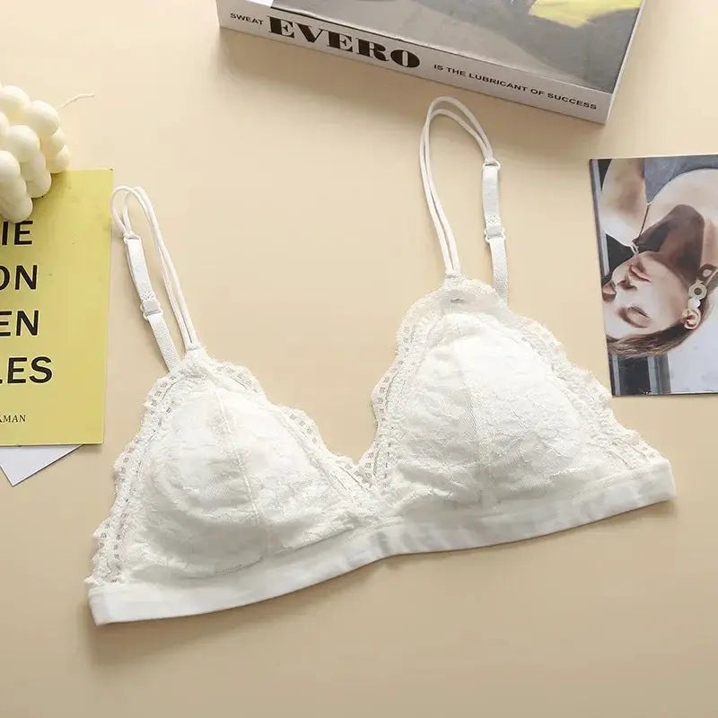 White lace bralette with scalloped edges, double adjustable straps, wireless cups, back hook closure