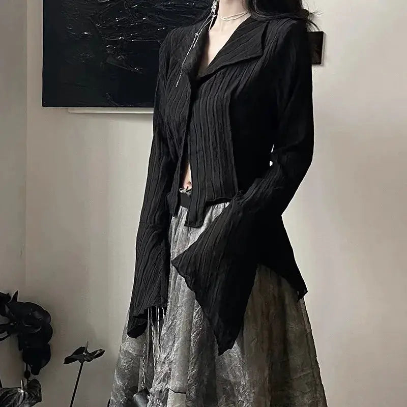 Karrram Gothic black shirt blouse and gray crinkled skirt worn by model