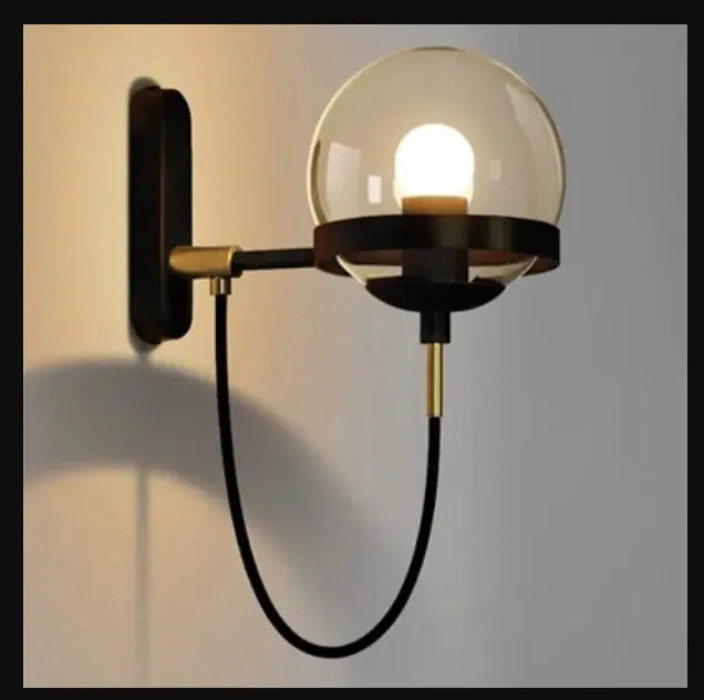 Simples Market modern glass ball wall lamp with clear globe, black metal arm, brass accents, E27 socket