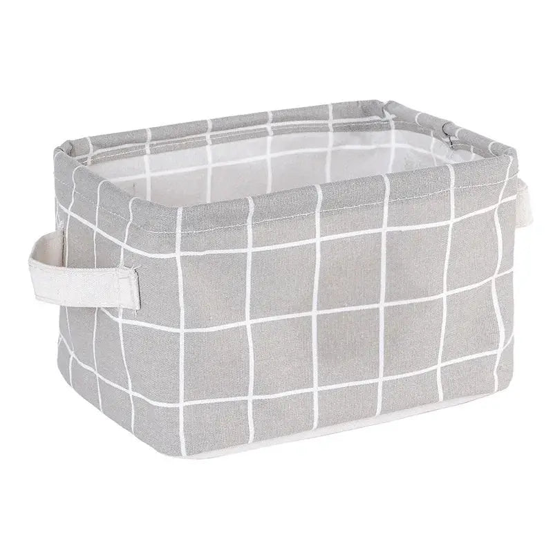 Grey linen storage basket with white grid pattern for desktop organization