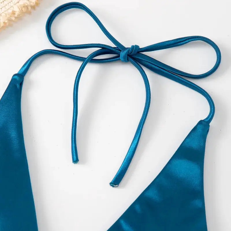 Halter bikini set in teal metallic satin; two-piece swimsuit with tie halter top