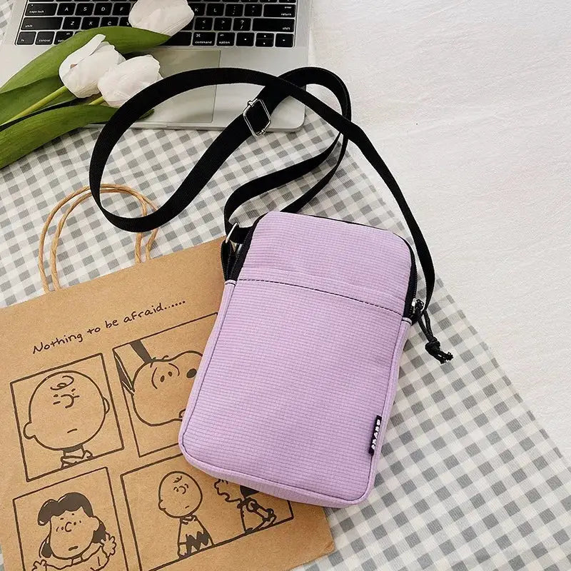 Simples Market lavender vertical shoulder bag for phones and cards with crossbody strap.