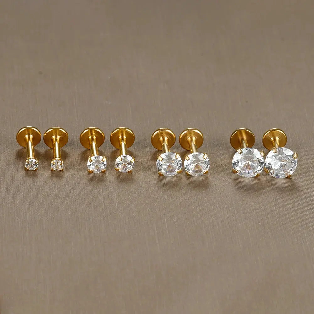 Set of six gold-tone labret tragus studs featuring clear CZ crystals