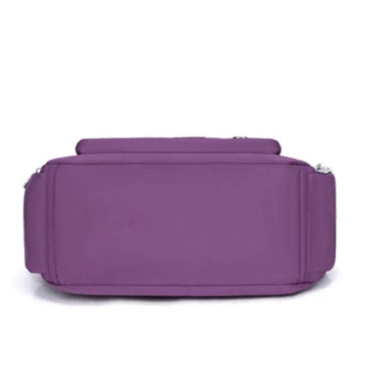 Simples Market purple nylon handbag with crossbody strap and multi-compartment design
