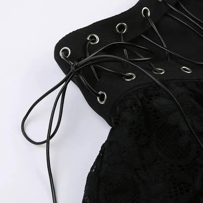 Gothic lace-up high-waisted mini skirt in black; metal grommets and lace panels.