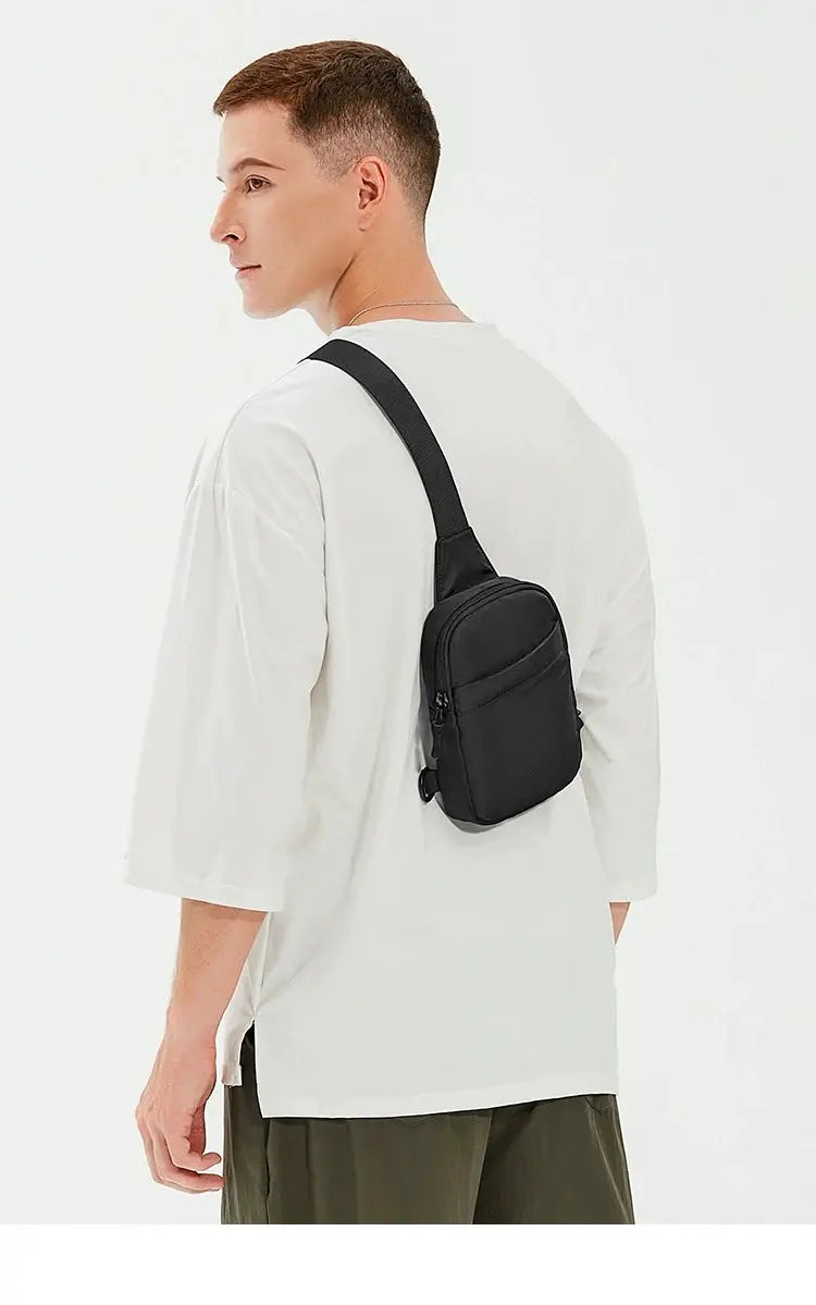 Simples Market 2-in-1 waist/chest bag in black, compact crossbody sling worn by a man