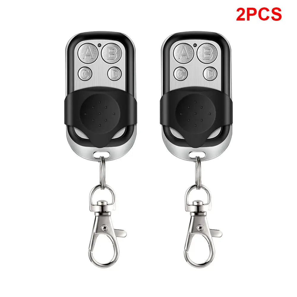 Universal garage door remote from Simples Market, 2-piece, 4-button, 433MHZ, black and silver keychain remotes
