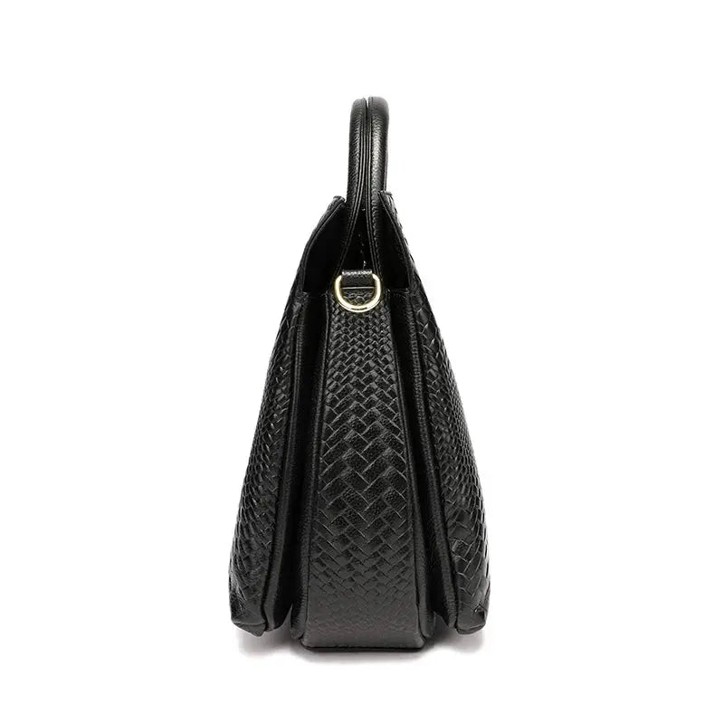Woven black cowhide handbag with top handles and gold-tone ring hardware.