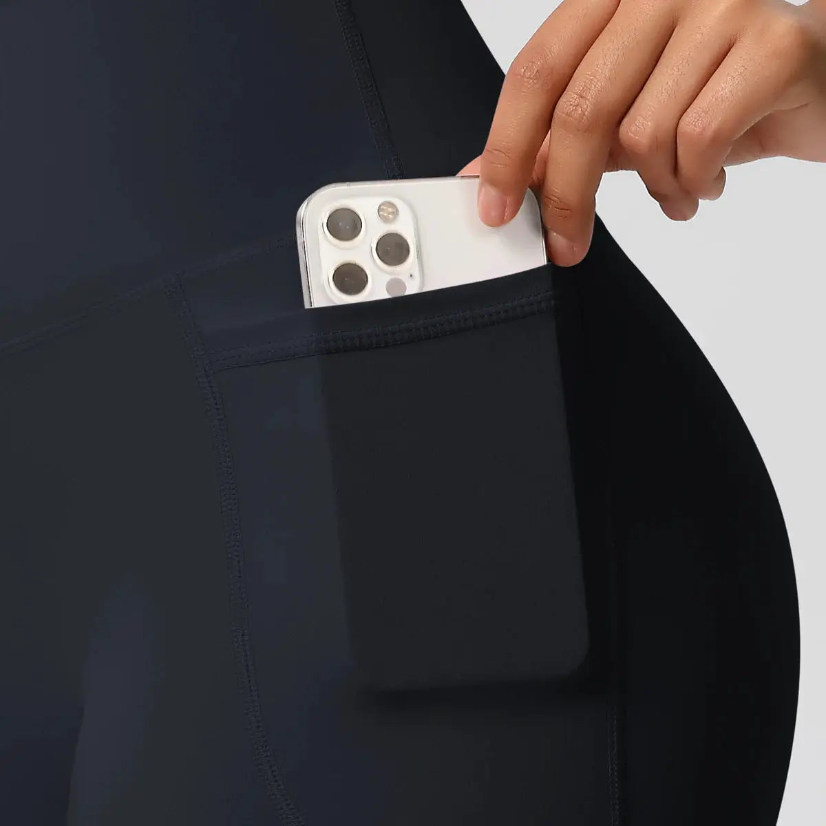 Women pocketed athletic shorts in black, high‑waist, quick-dry fabric by Simples Market.