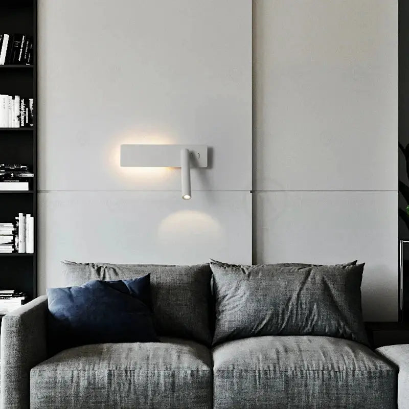 LED wall reading lamp by Simples Market; white with rotating arm, minimalist bedside sconce
