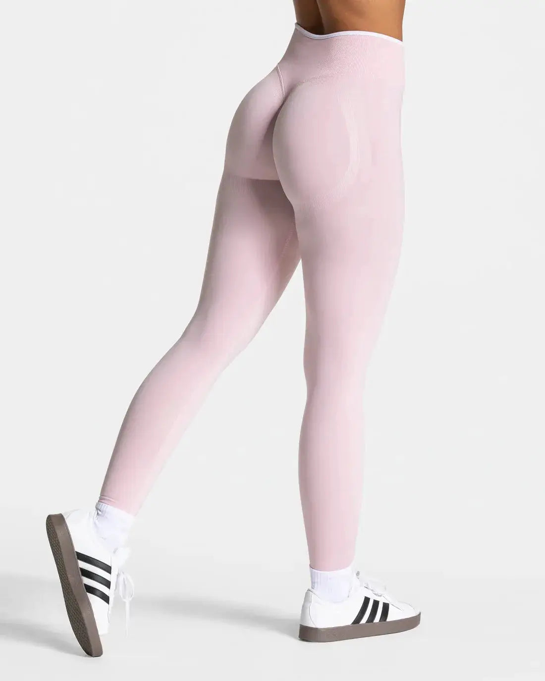 Women's pink seamless knitted high-waist yoga leggings with white-edge waistband for gym workouts by Simples Market