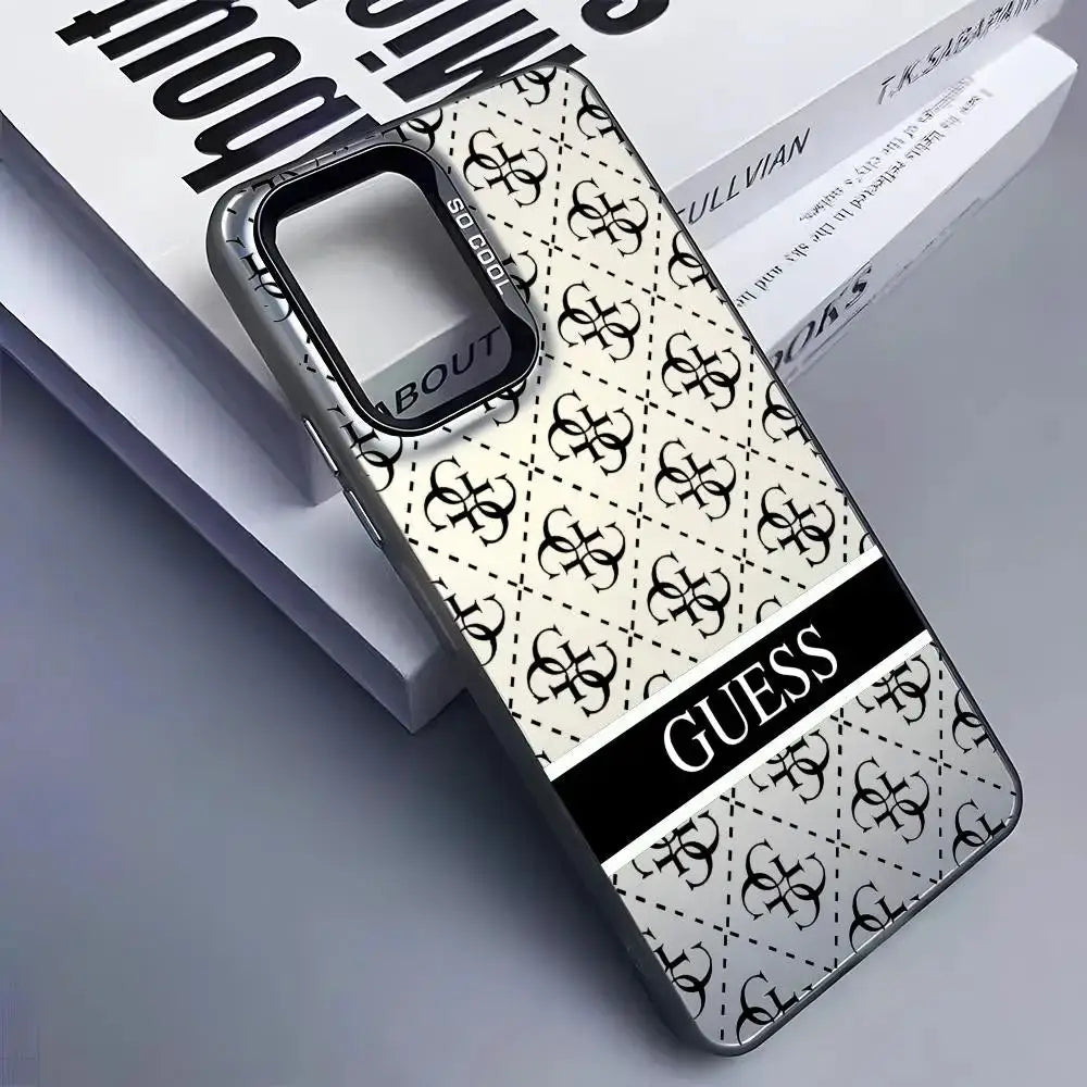Guess phone case for Samsung Galaxy in silver with repeating logo pattern and bold GUESS stripe.