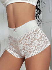 White lace high-waist panties with a floral pattern and small bow detail.