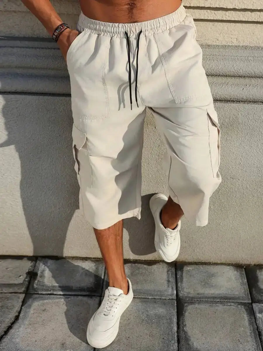 Manfinity Homme beige cargo capri pants with drawstring waist and side cargo pockets