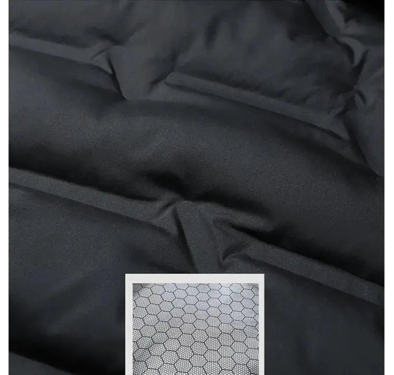 Winter men's down jacket fabric close-up in black with inset honeycomb-pattern label