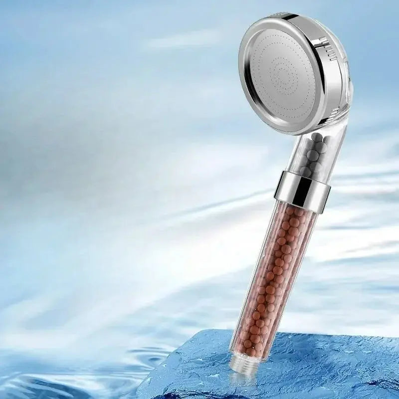 Handheld rainfall shower head with chrome finish and clear filter tube featuring brown anion beads