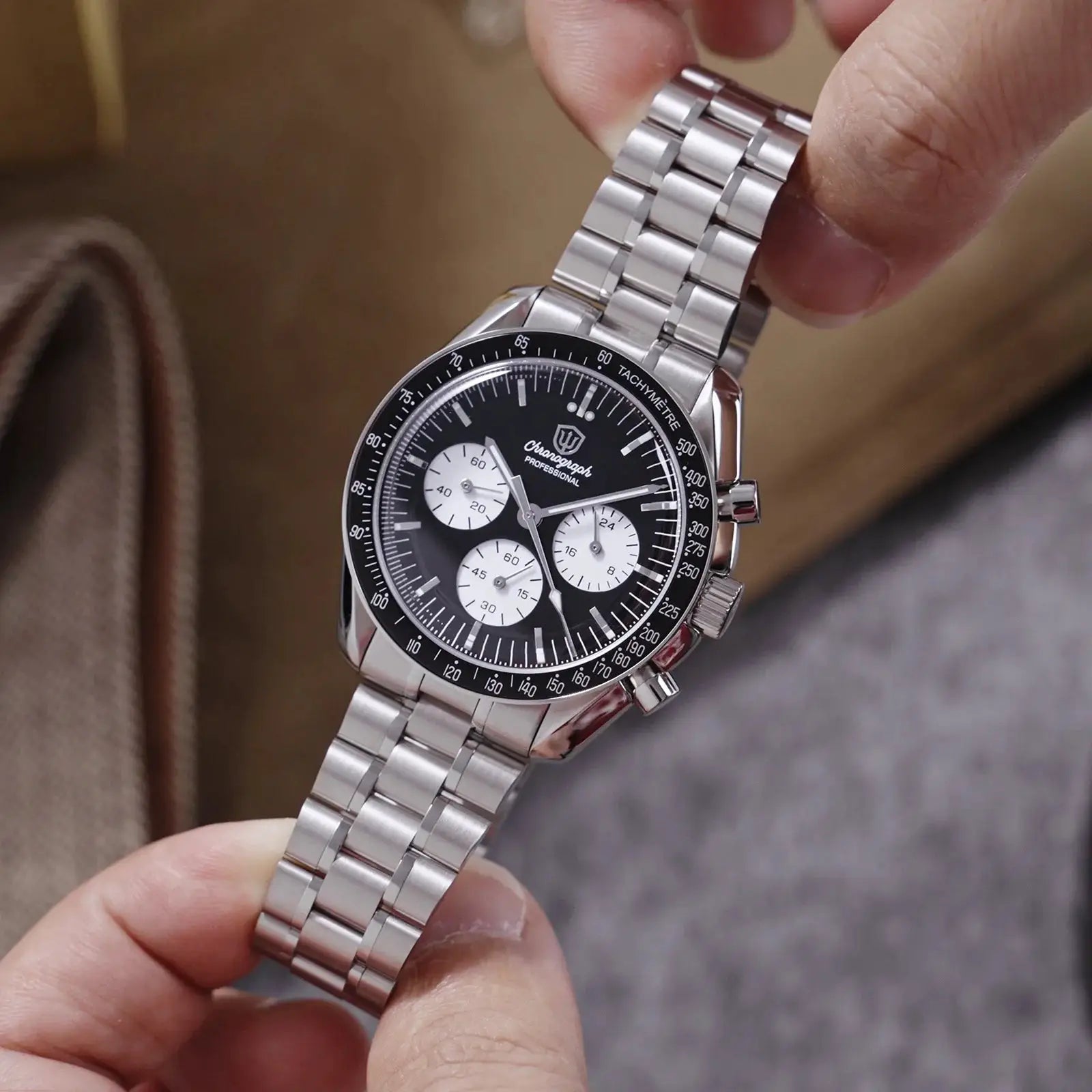 Watchdives WD1863 chronograph watch with stainless steel bracelet, black dial, white subdials, and tachymeter bezel