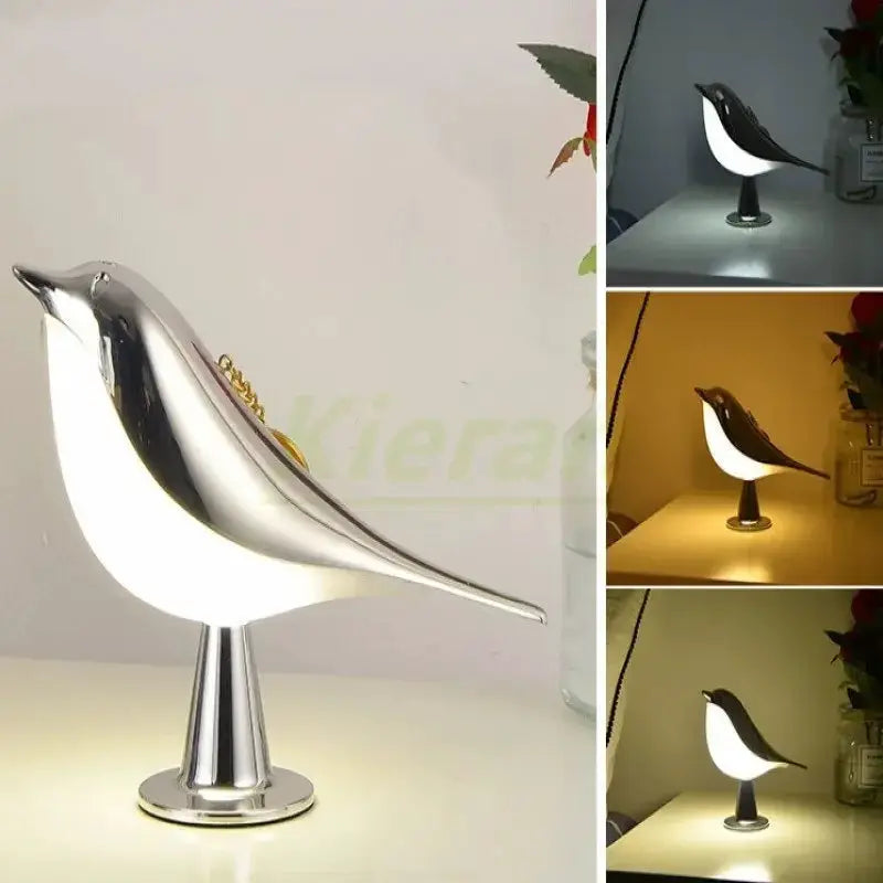 Magpie-shaped LED desk lamp with chrome finish and white glow on a round base