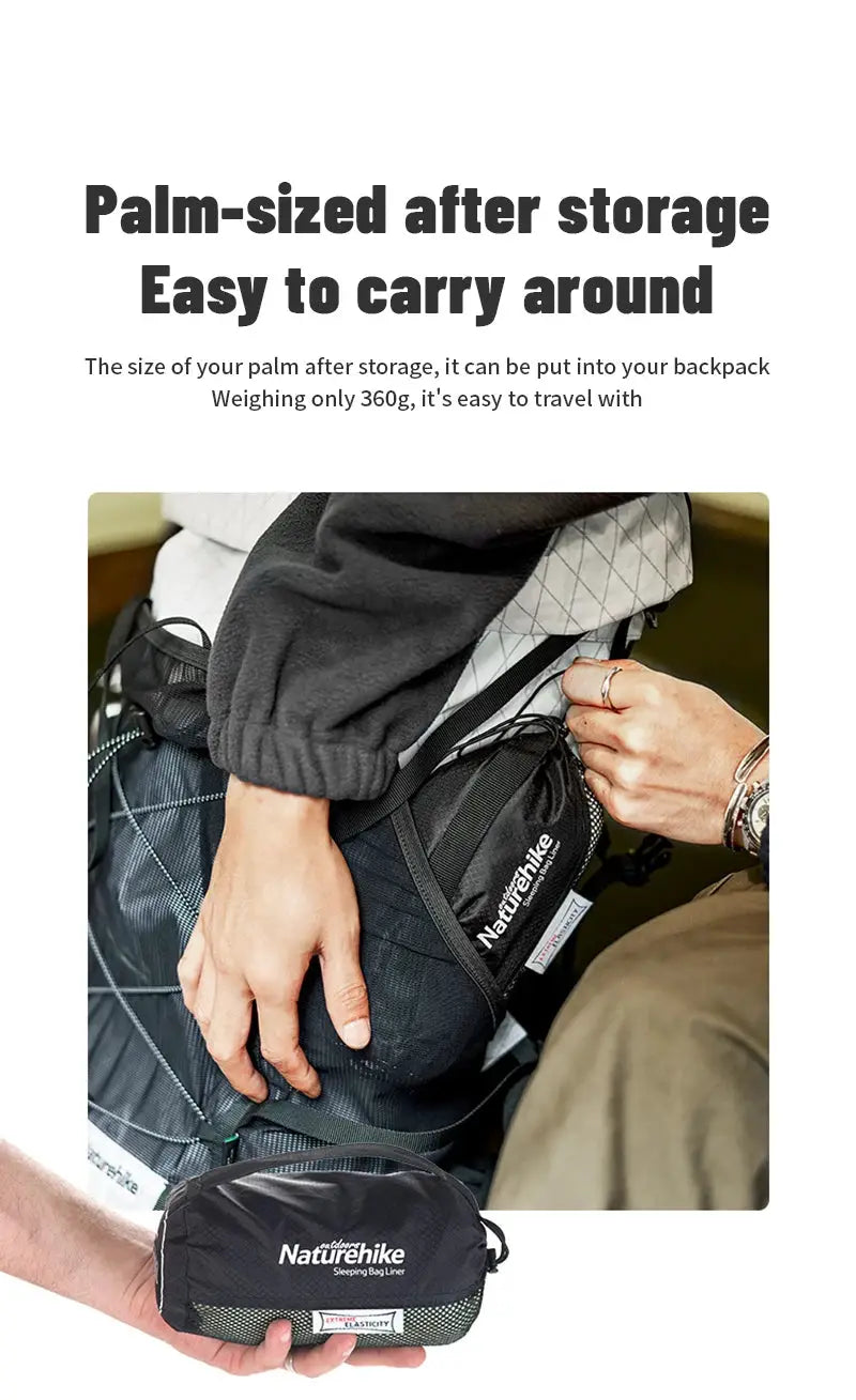 Naturehike sleeping bag liner, black ultralight portable camping gear, shown in its compact pouch.