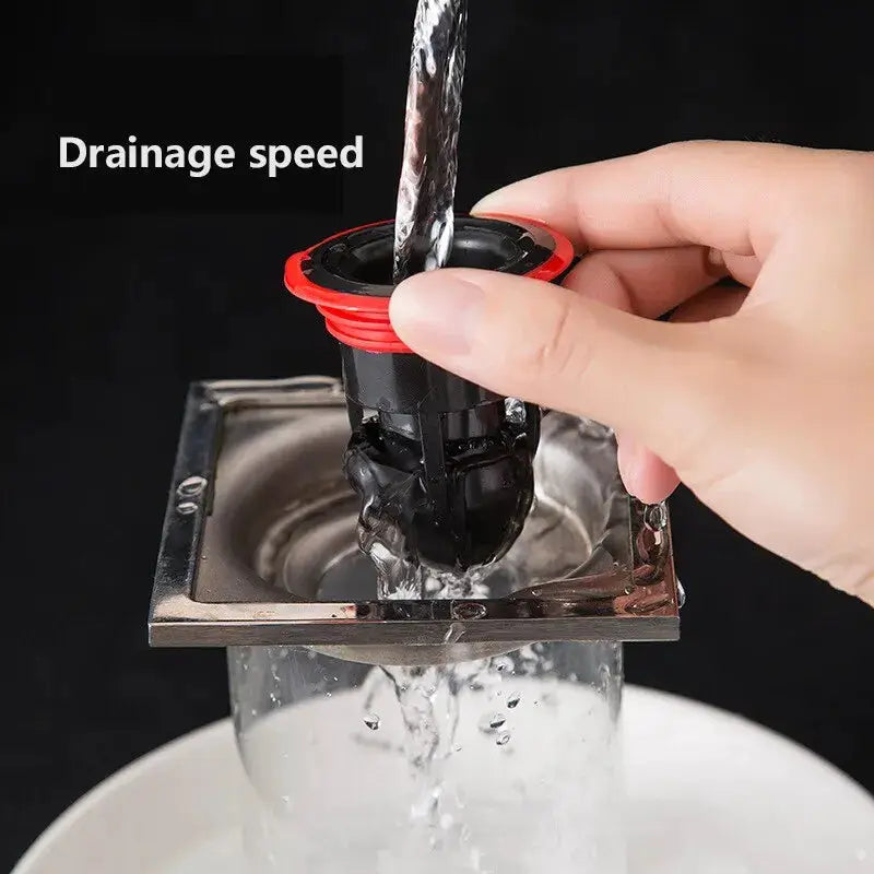 Floor drain anti-odor core device with red ring and black housing by Simples Market