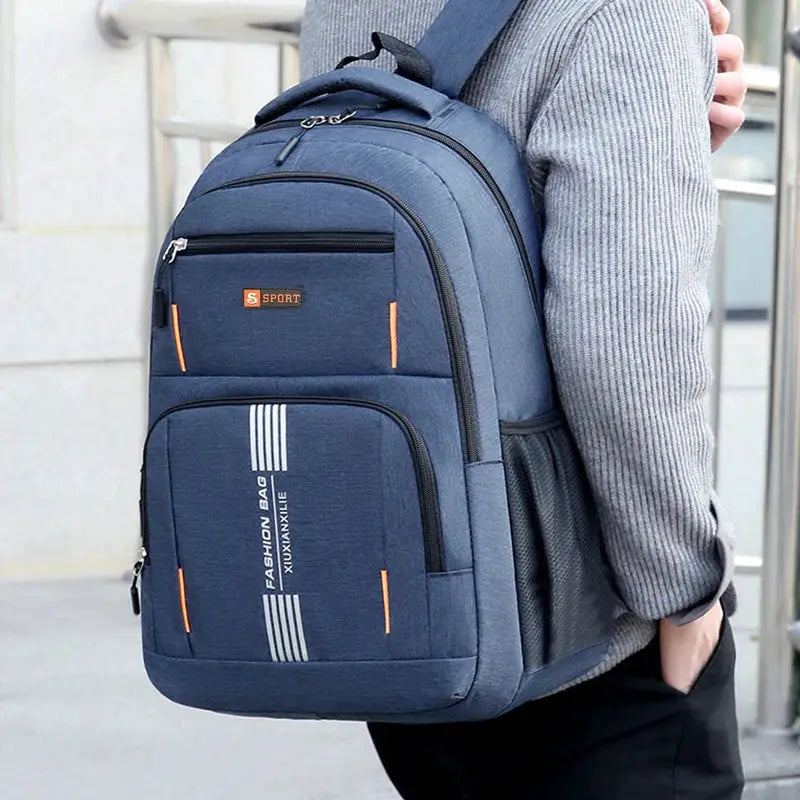 Fashion Minimalist Men’s Rucksack; navy nylon backpack with orange zipper accents and multiple storage pockets