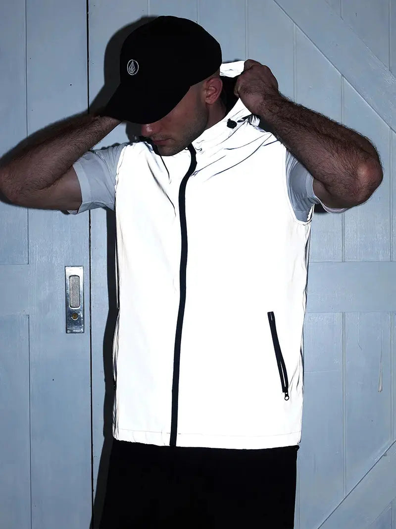 Night Reflective Vest by Simples Market, white sleeveless outerwear with black front zipper and pockets