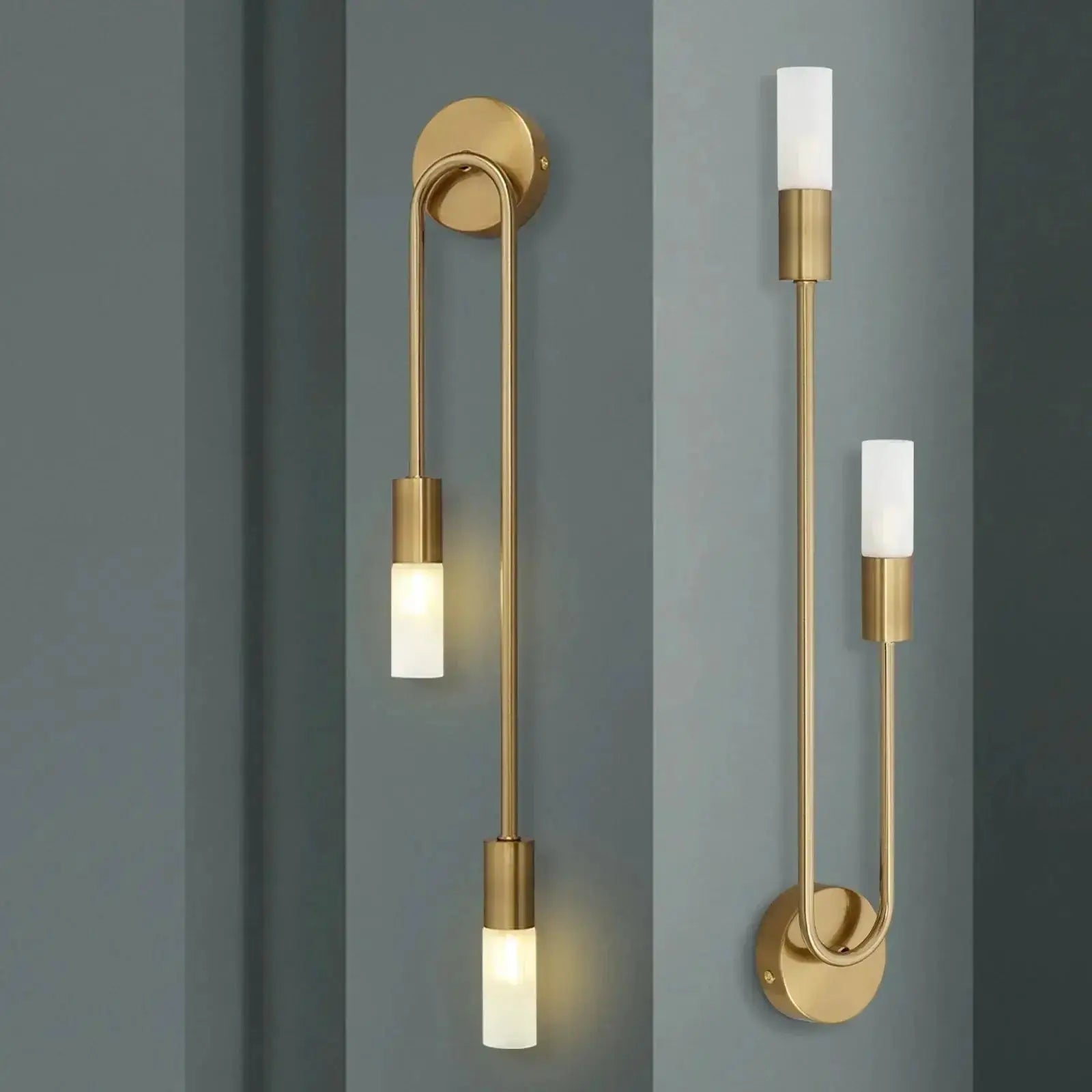 Pair of LED gold wall lamps with frosted cylindrical shades in minimalist Nordic style.