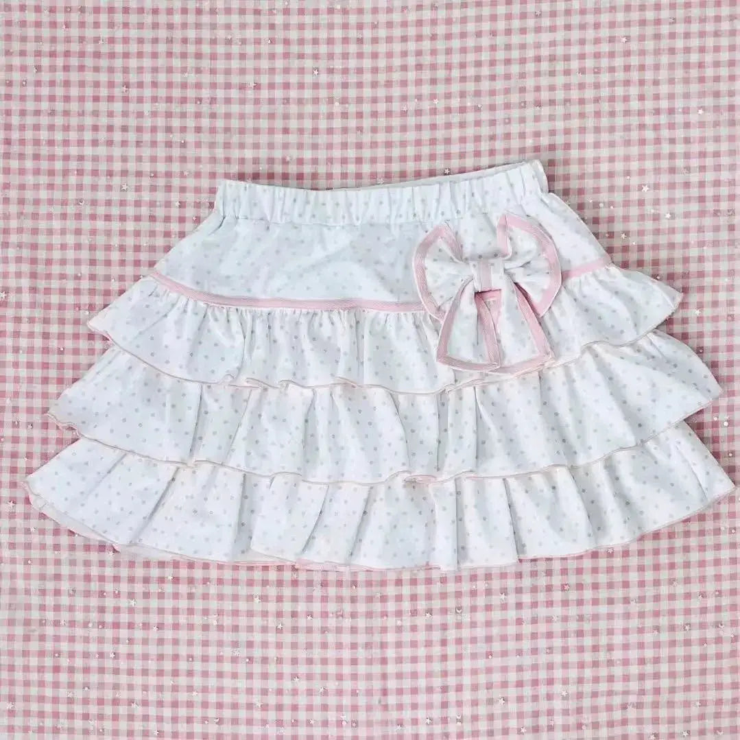 Harajuku Lolita mini skirt, white with tiny blue polka dots, pink trim, bow, and layered ruffles