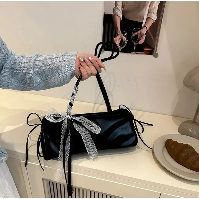 Black PU square shoulder bag with white lace bow on the handle and long side ribbons
