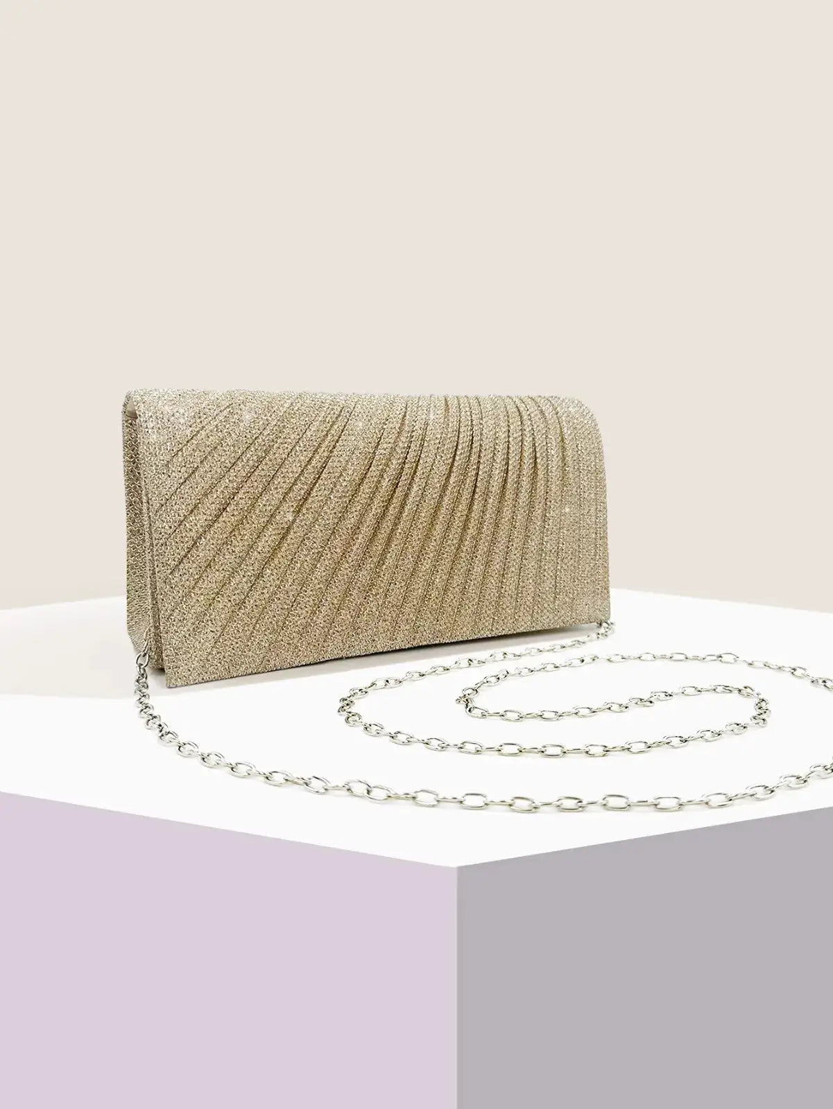 Gold glitter evening clutch with silver chain strap for weddings and parties