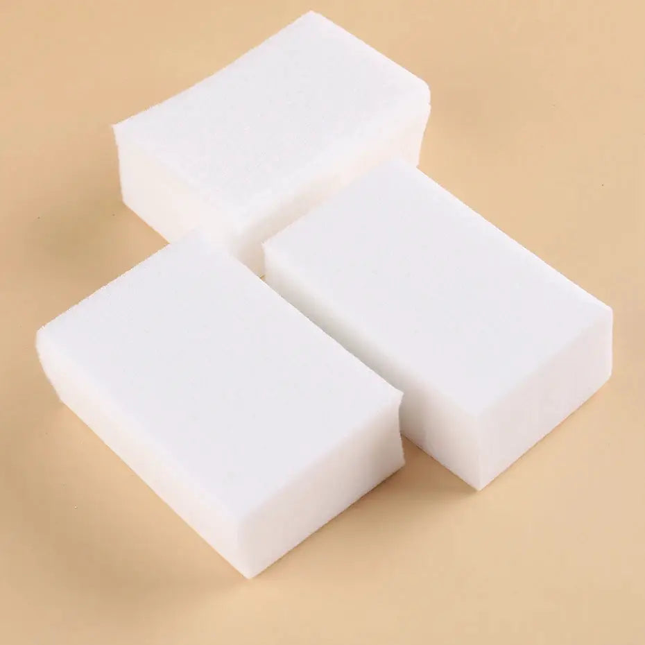 Three white lint-free nail polish remover wipe blocks for manicure cleanup