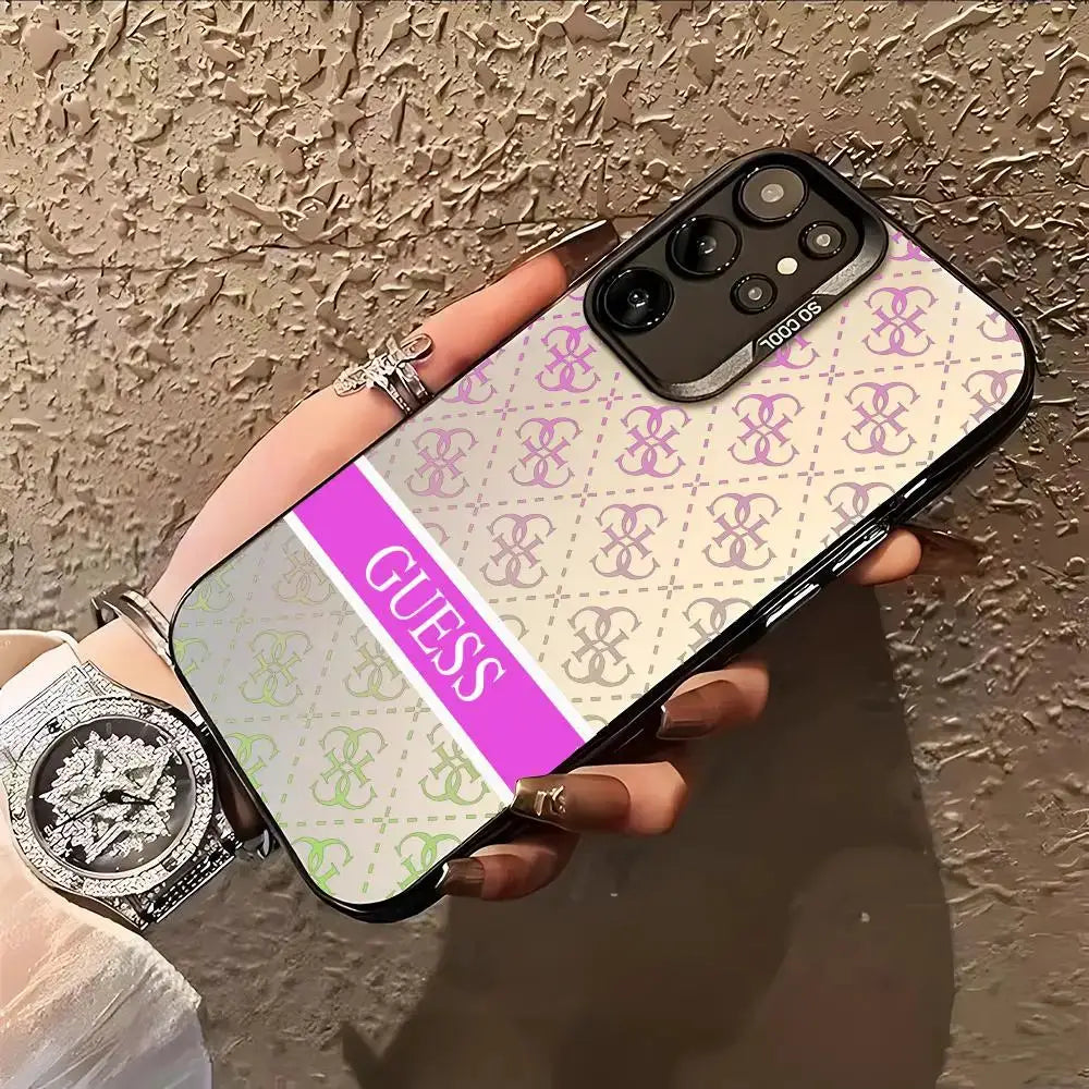 GUESS phone case for Samsung Galaxy; colorful silver cover with repeated GUESS logo pattern and purple stripe.