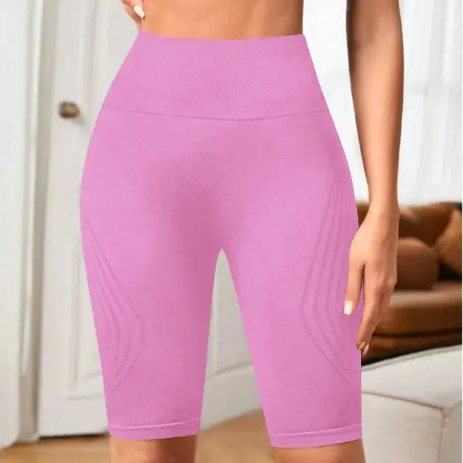 Simples Market high-waisted seamless yoga shorts, pink, knee-length, stretchy for workouts.