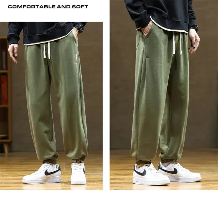 Men's olive green sweatpants with drawstring, loose jogger fit and elastic cuffs